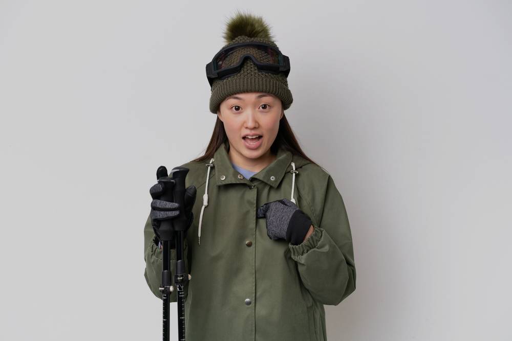 shocked Asian woman in winter clothes