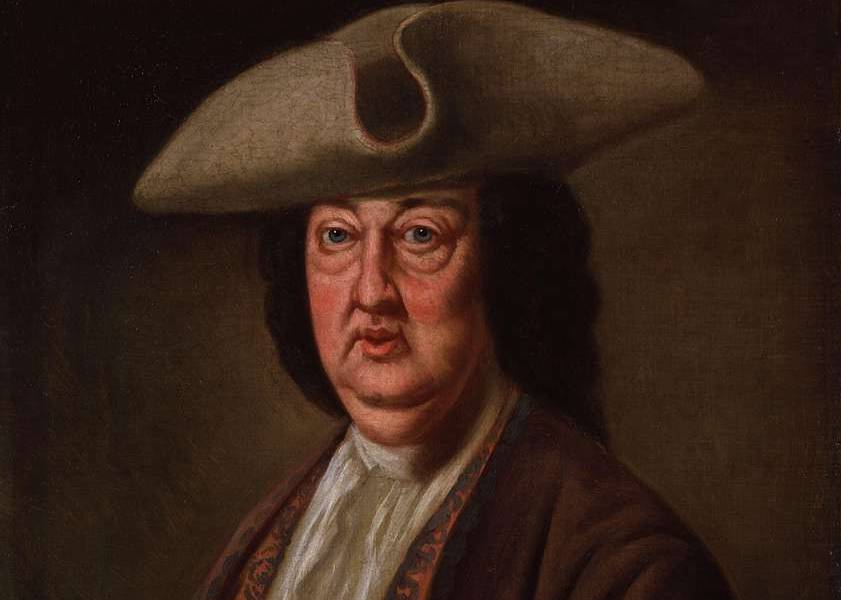 Beau Nash in brown clothes and a hat