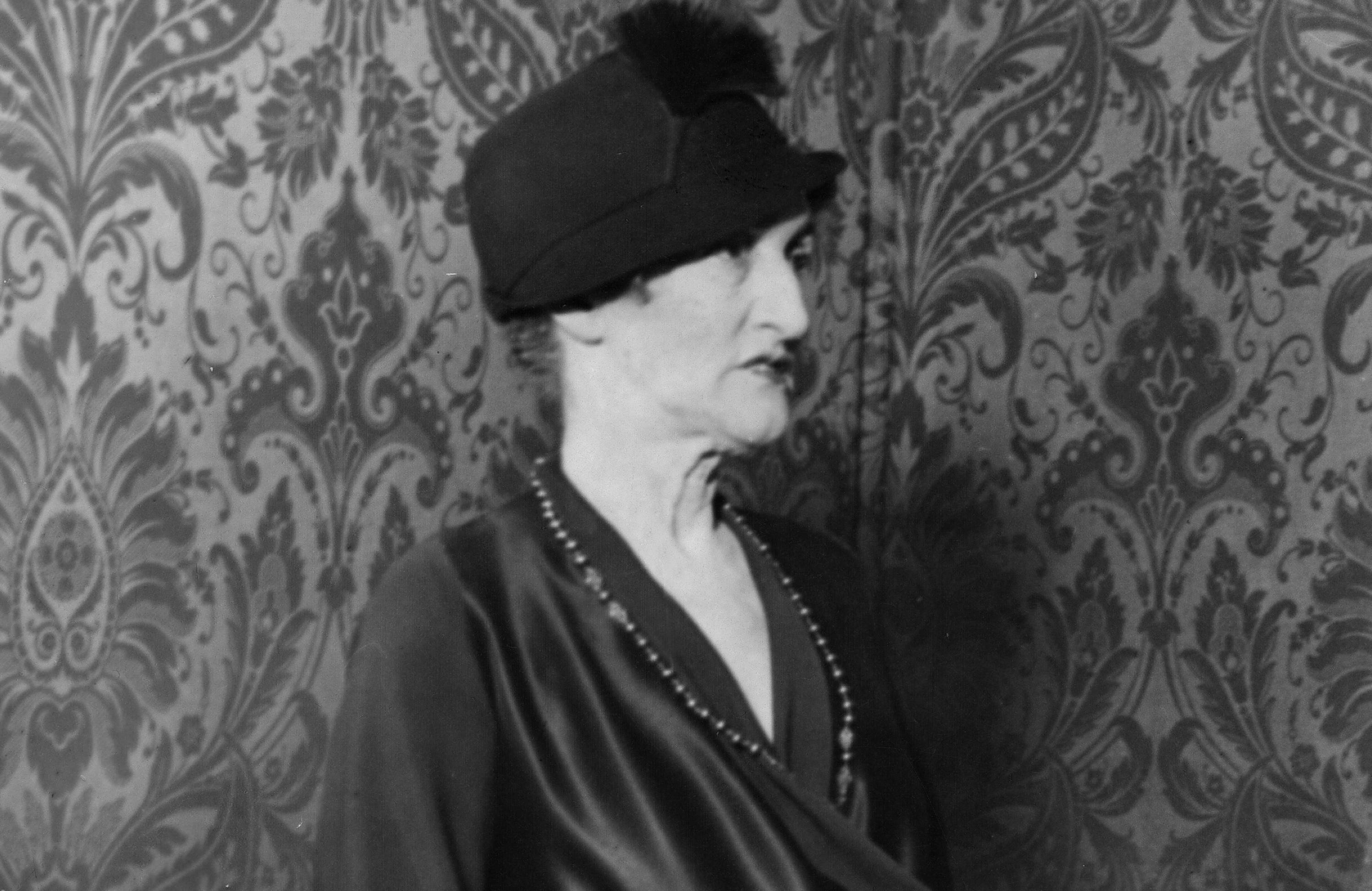 Lady Margot Asquith in black and a hat