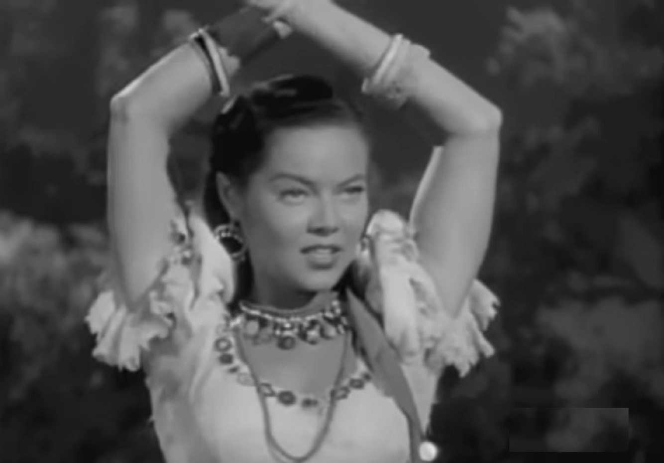 Screenshot of Dona Drake dancing and looking at side - from The Bandits of Corsica (1953)