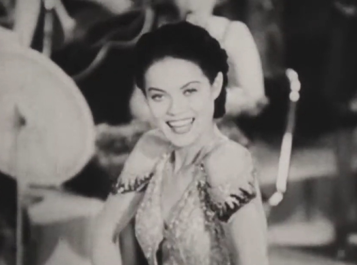 Screenshot of Dona Drake dancing on stage - from Sweet Shoe (1938)