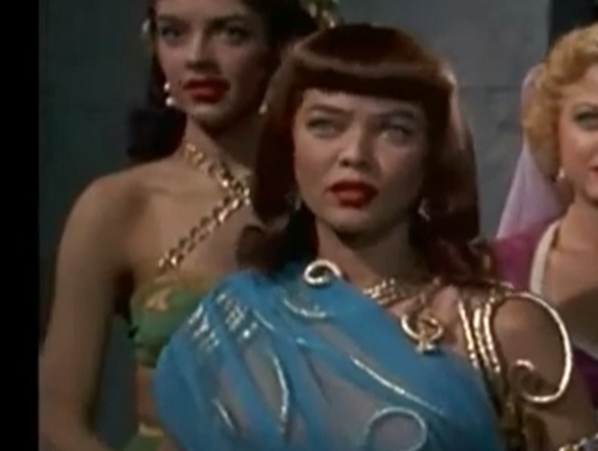 Screenshot of Dona Drake in blue dress looking at front - from Princess of the Nile (1954)