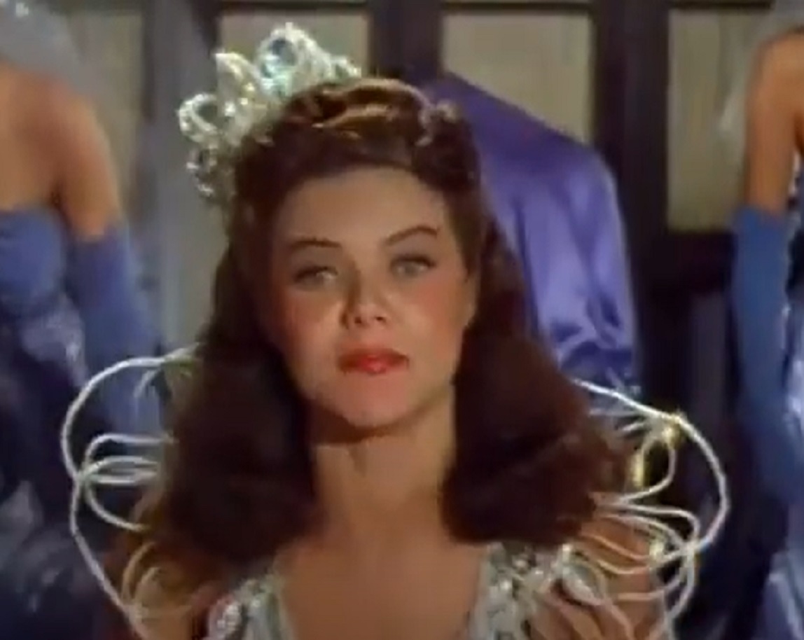 Screenshot of Dona Drake wearing crown and looking sad - from Louisiana Purchase (1941)