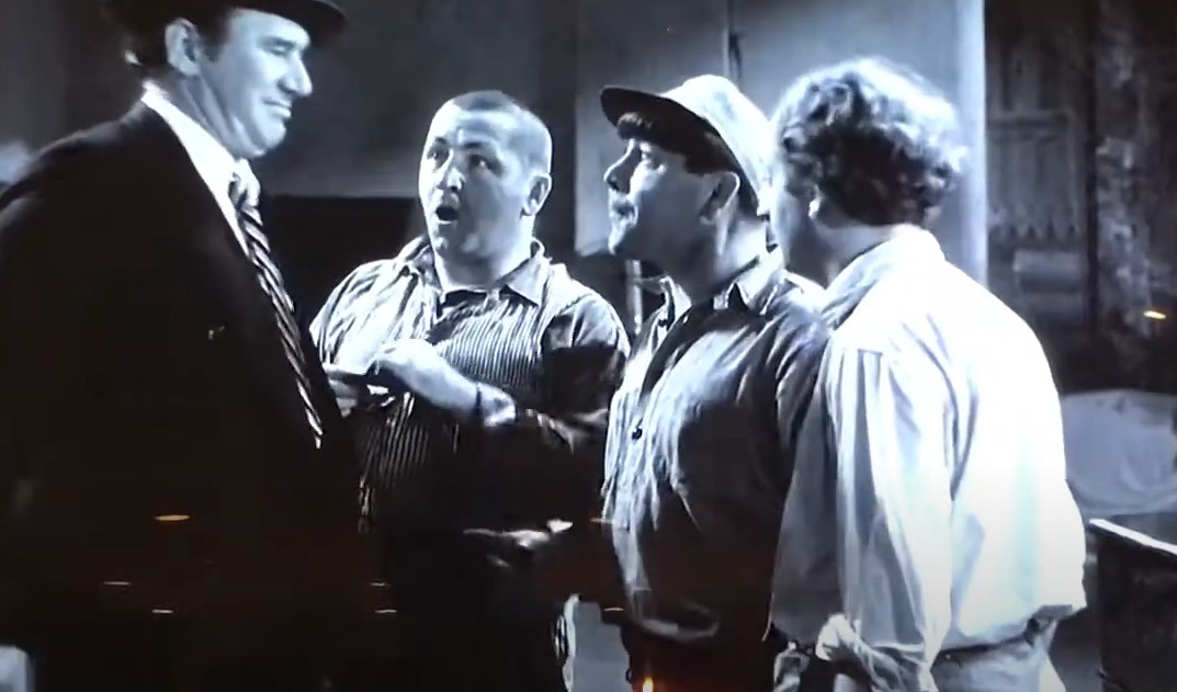 Ted Healy wearing suit and hat