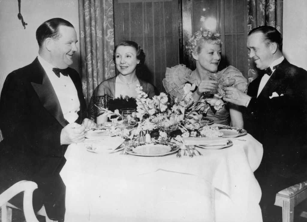 Stan Laurel and Oliver Hardy with their wives