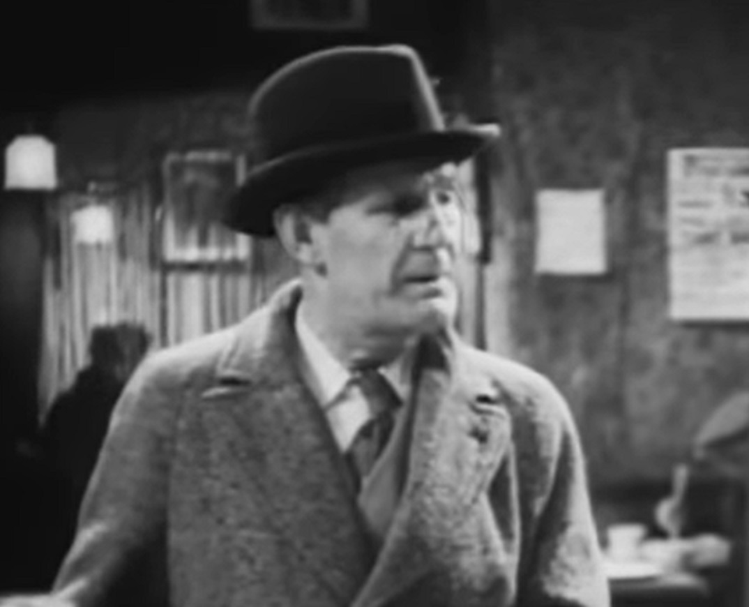 Screenshot of Will Hay looking at side - from Convict 99 (1938)