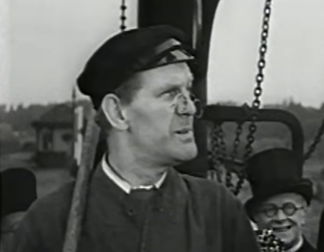 Screenshot of Will Hay looking at side - from Ask a Policeman (1939)
