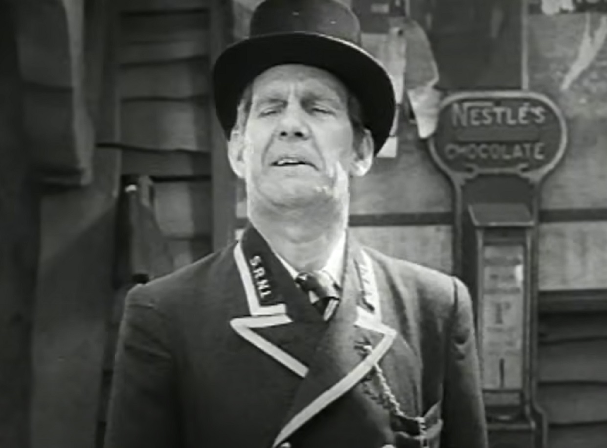 Screenshot of Will Hay wearing hat is looking at side - from Oh, Mr Porter! (1937)