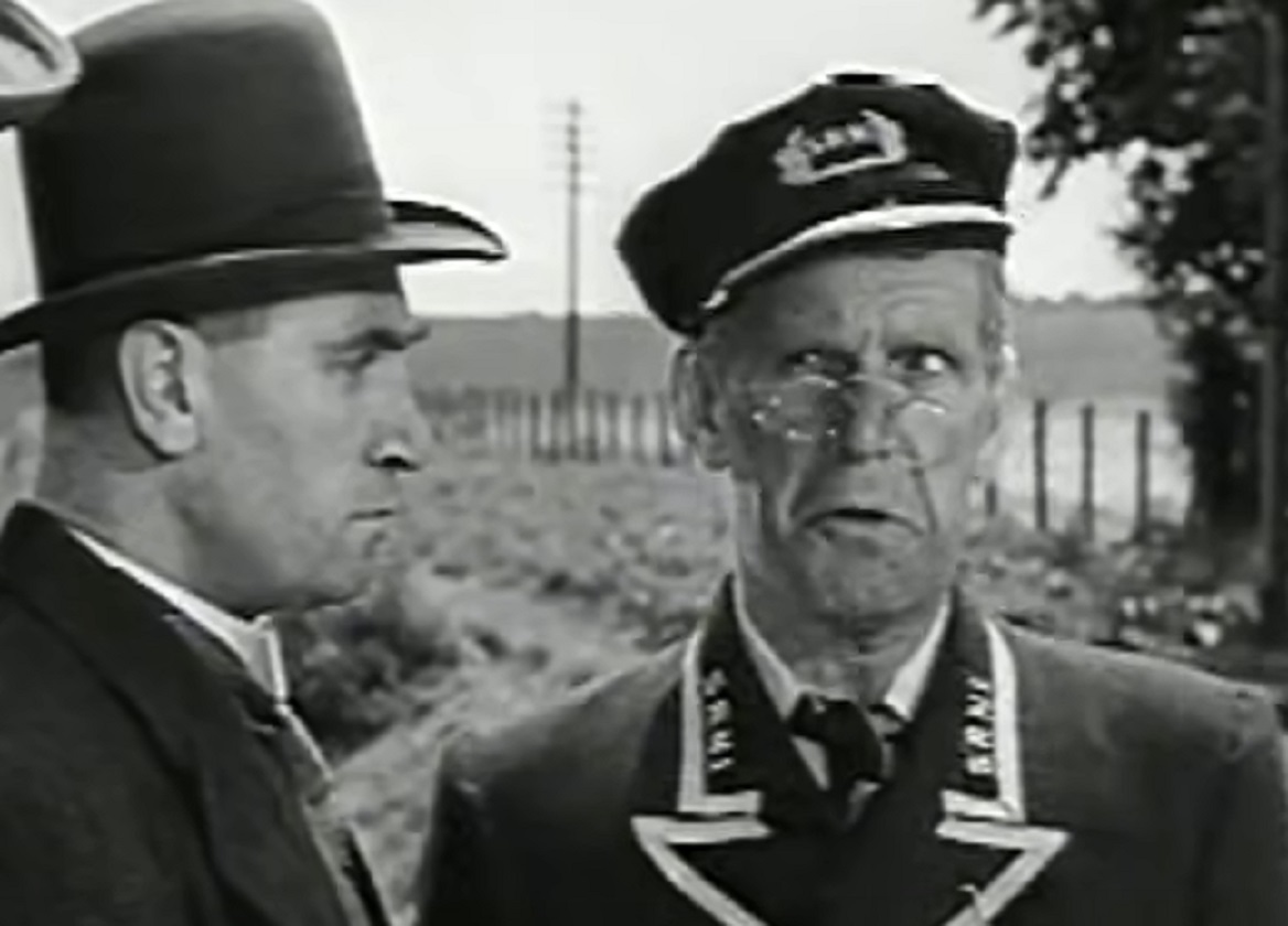 Screenshot of Will Hay talking with other man - from Oh, Mr Porter! (1937)