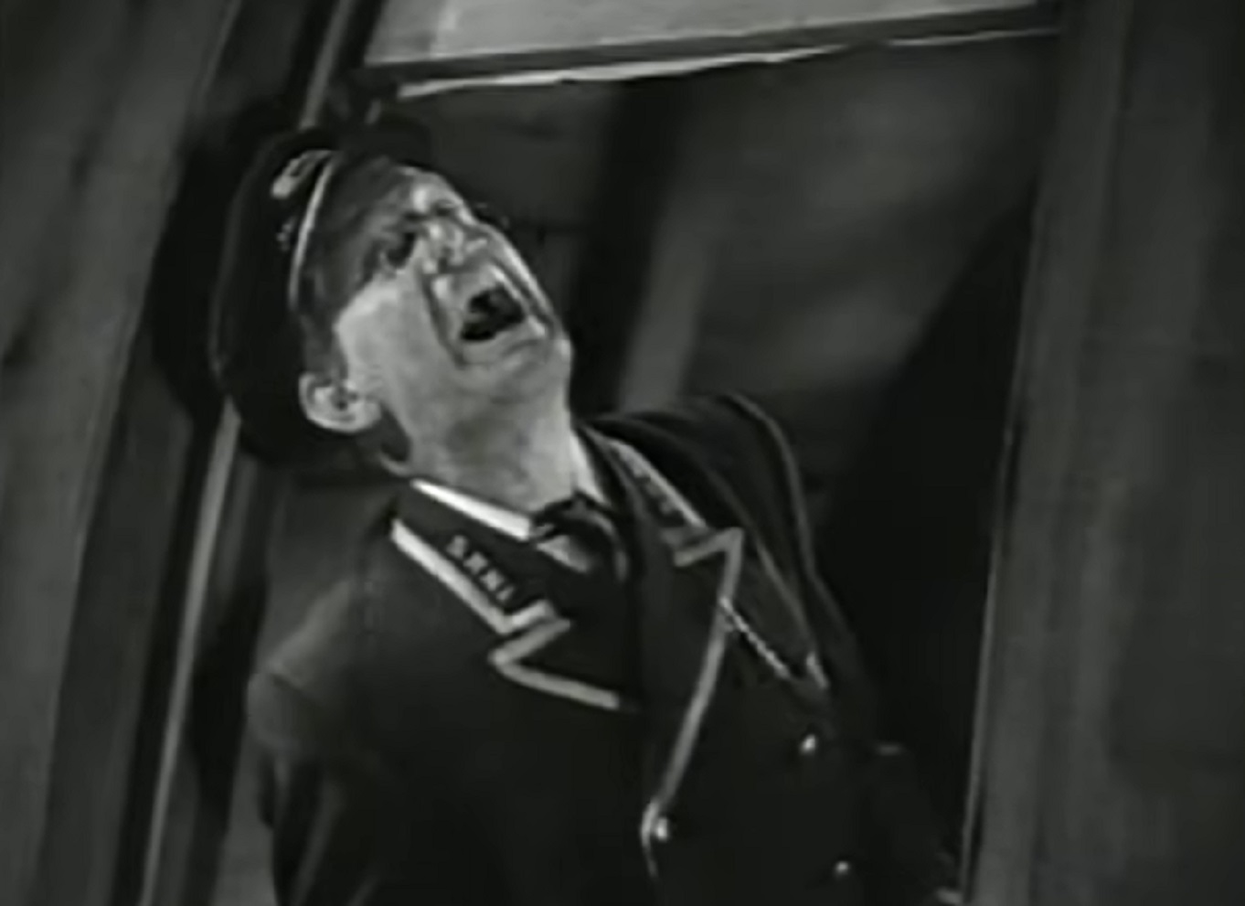 Screenshot of Will Hay looking up and talking - from Oh, Mr Porter! (1937)