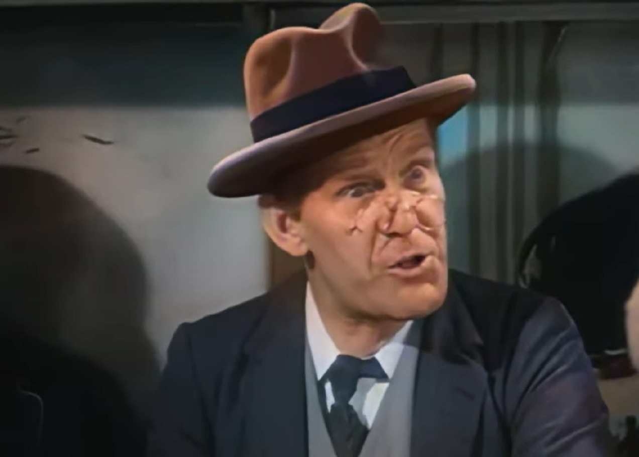 Screenshot of Will Hay wearing hat is looking surprised - from Oh, Mr Porter! (1937)