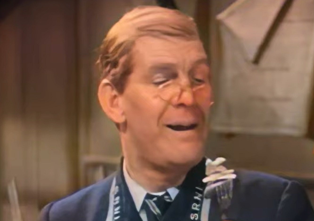 Screenshot of Will Hay looking down and smiling - from Oh, Mr Porter! (1937)