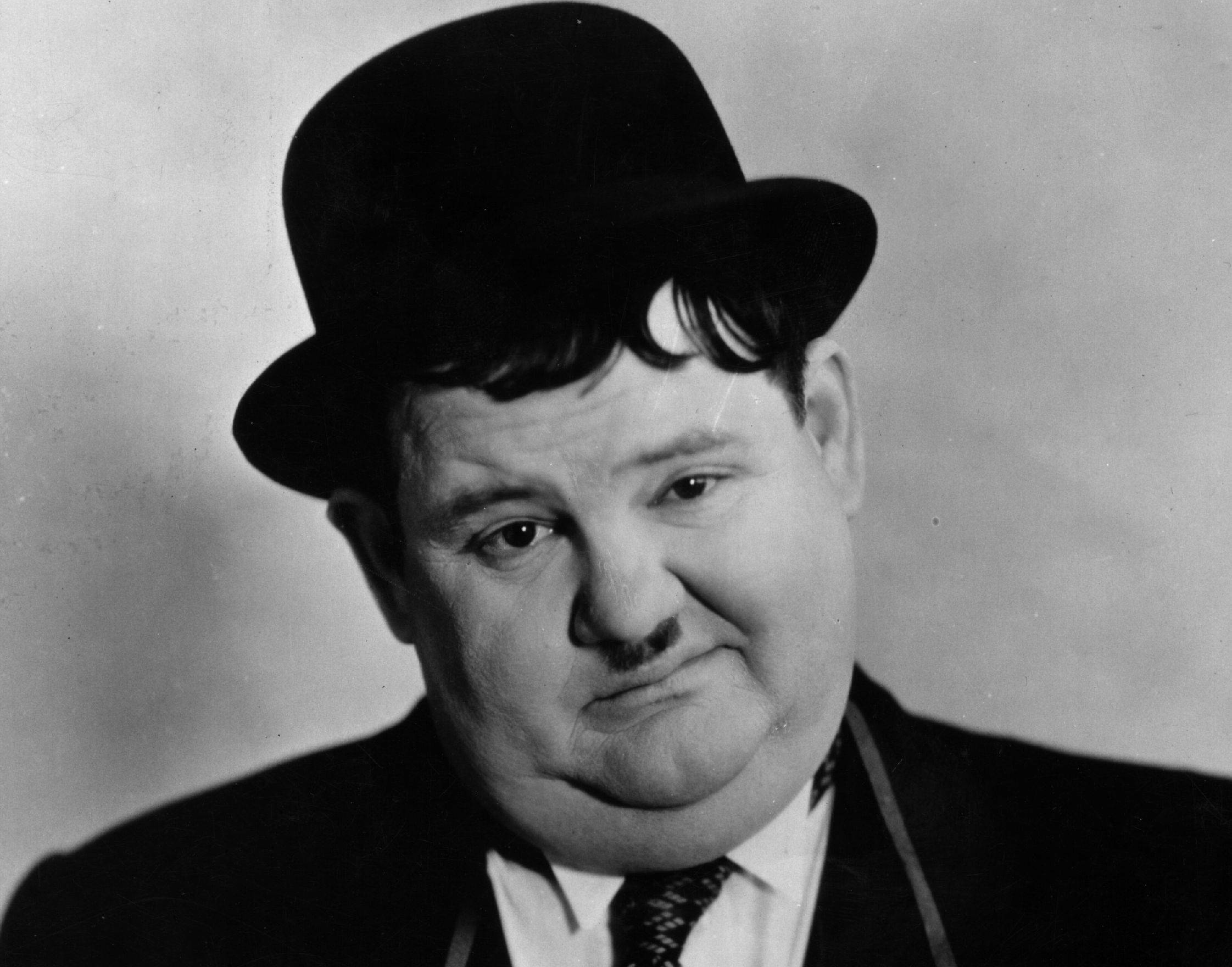 American comedian Oliver Hardy in suit and hat