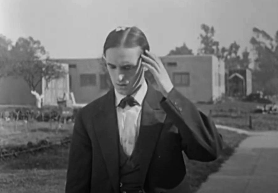 Stan Laurel in The Pest, 1922 feeling down