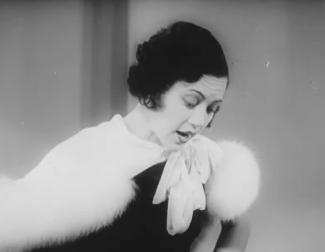 Screenshot of Fredi Washington looking down upset - from Ouanga (1936)