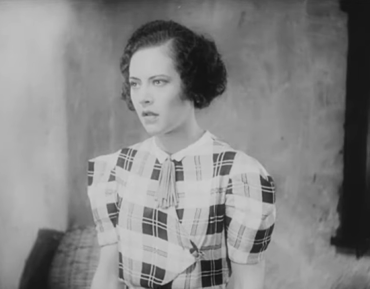 Screenshot of Fredi Washington looking at side in b&W dress - from Ouanga (1936)