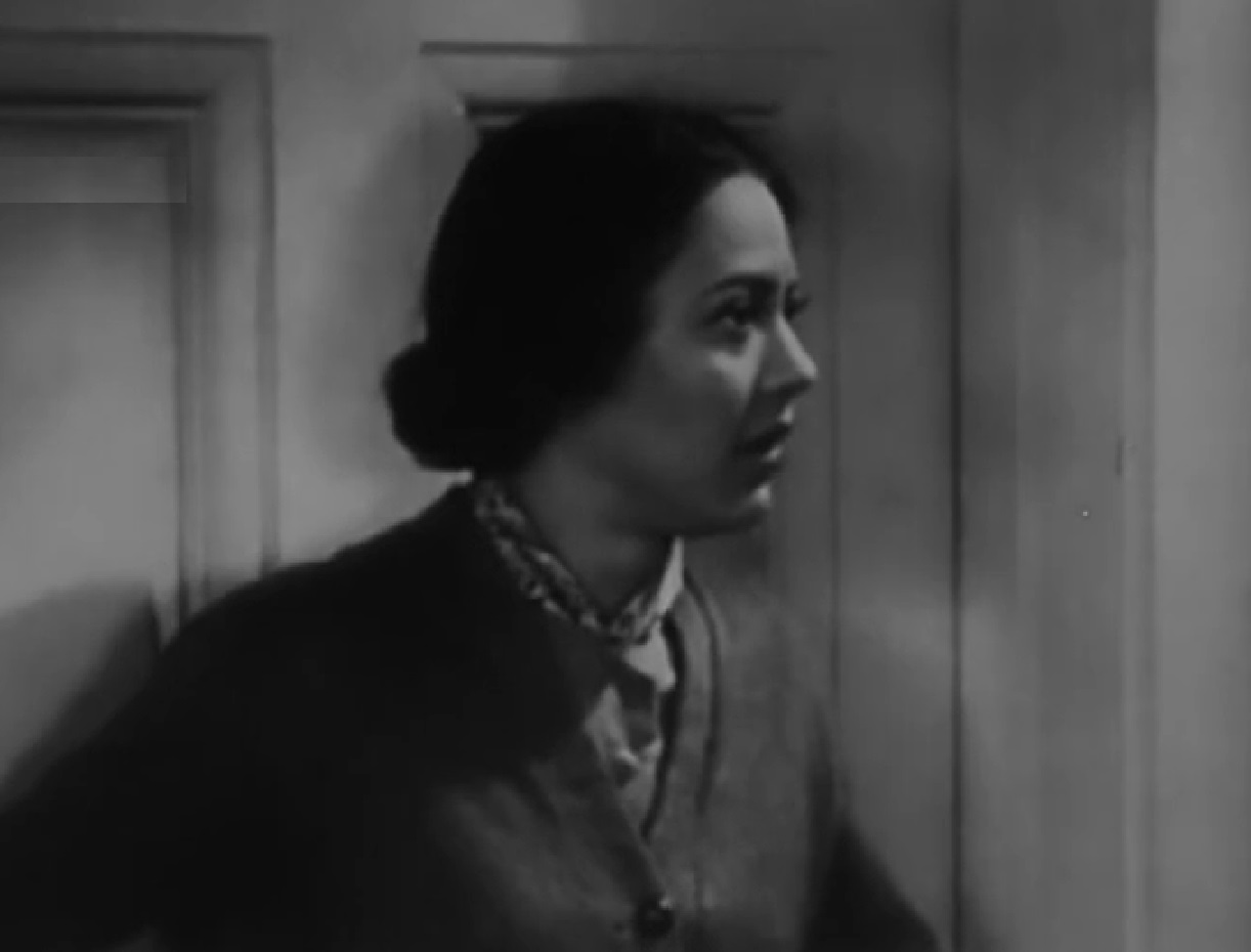 Screenshot of Fredi Washington looking at side upset - from One Mile from Heaven (1937)