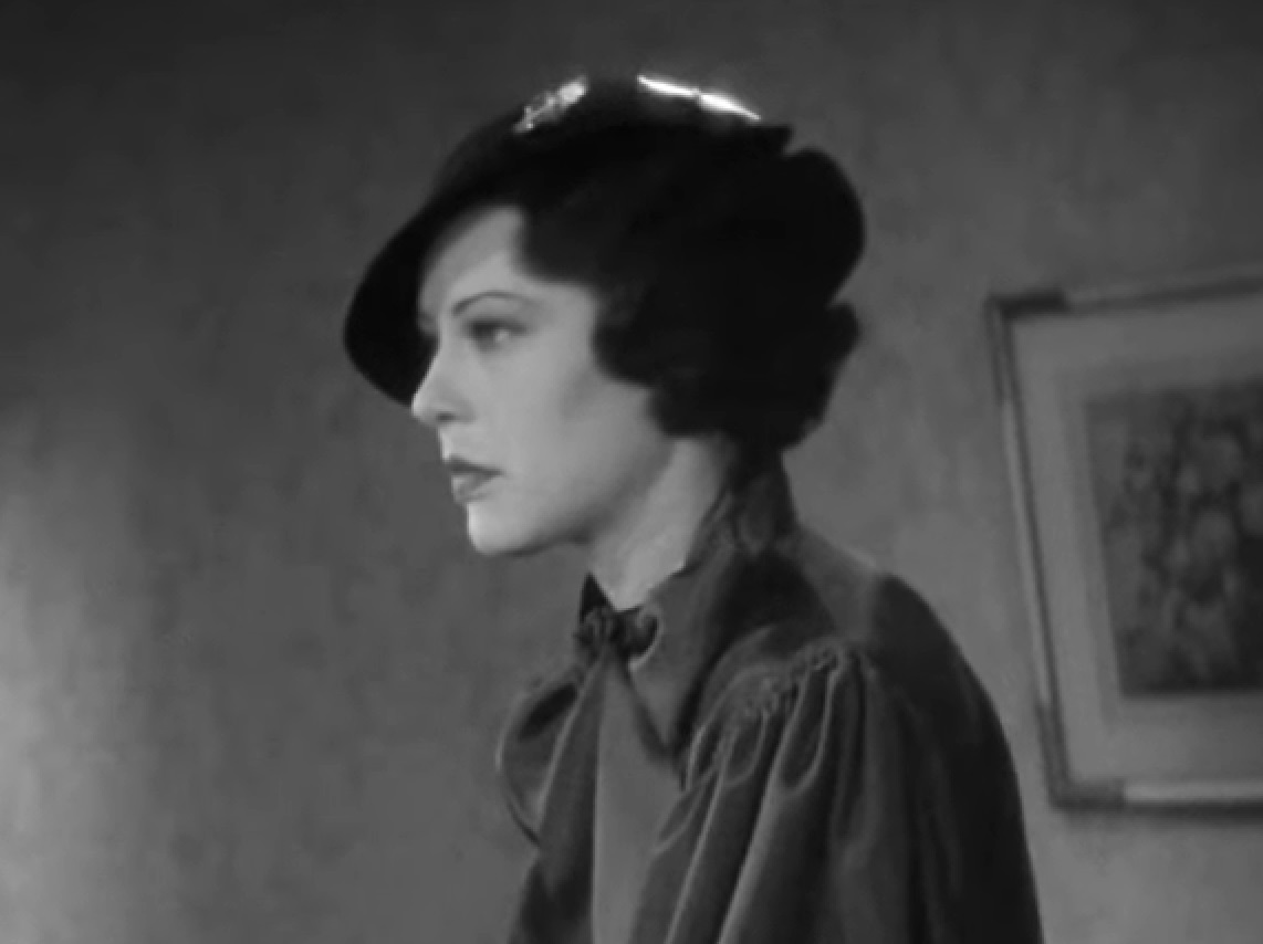 Screenshot of Fredi Washington with black hat is looking at side - from Imitation of Life (1934)