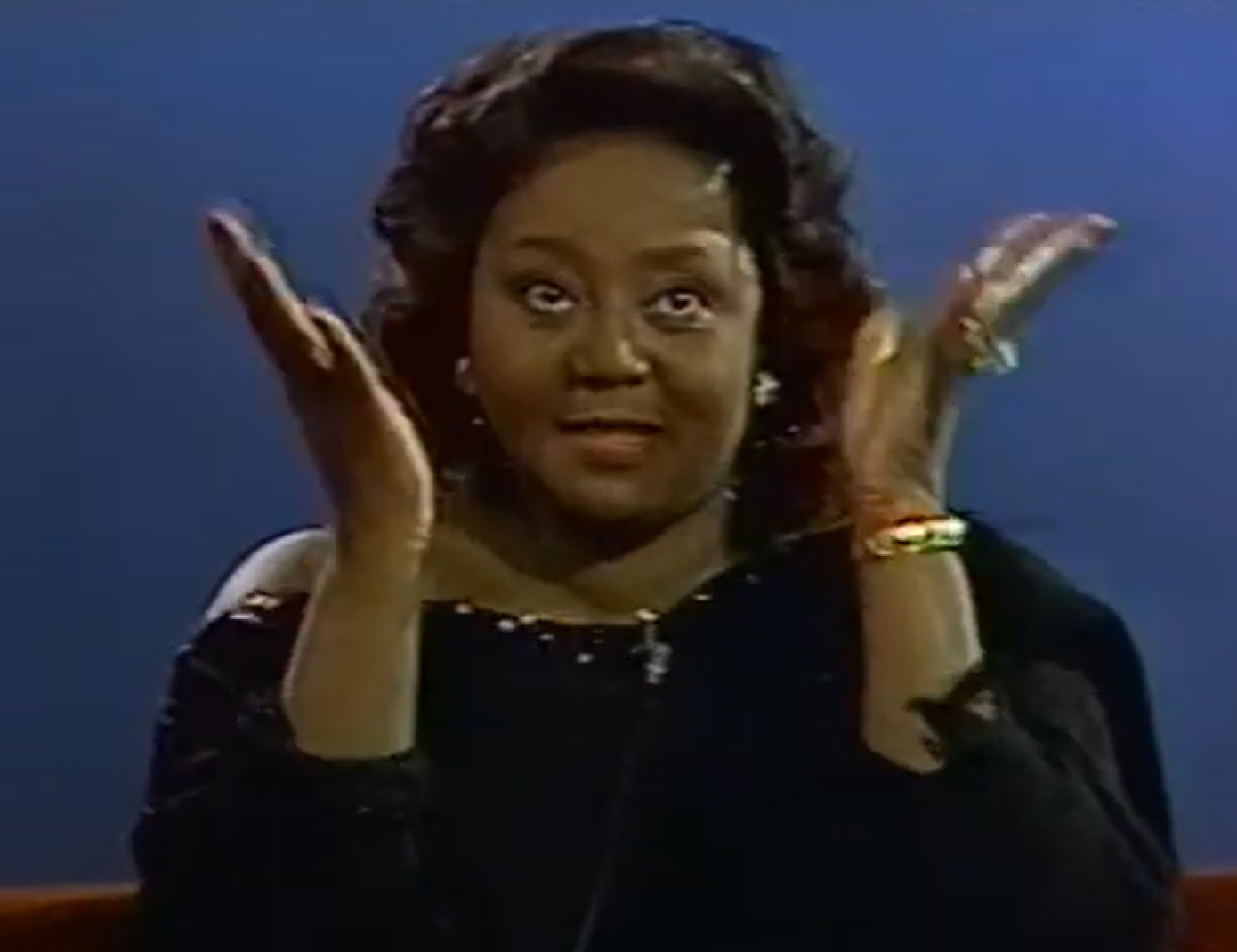 Screenshot of Joyce Bryant pointing with hands up - from The David Susskind Show - (1958–1987)