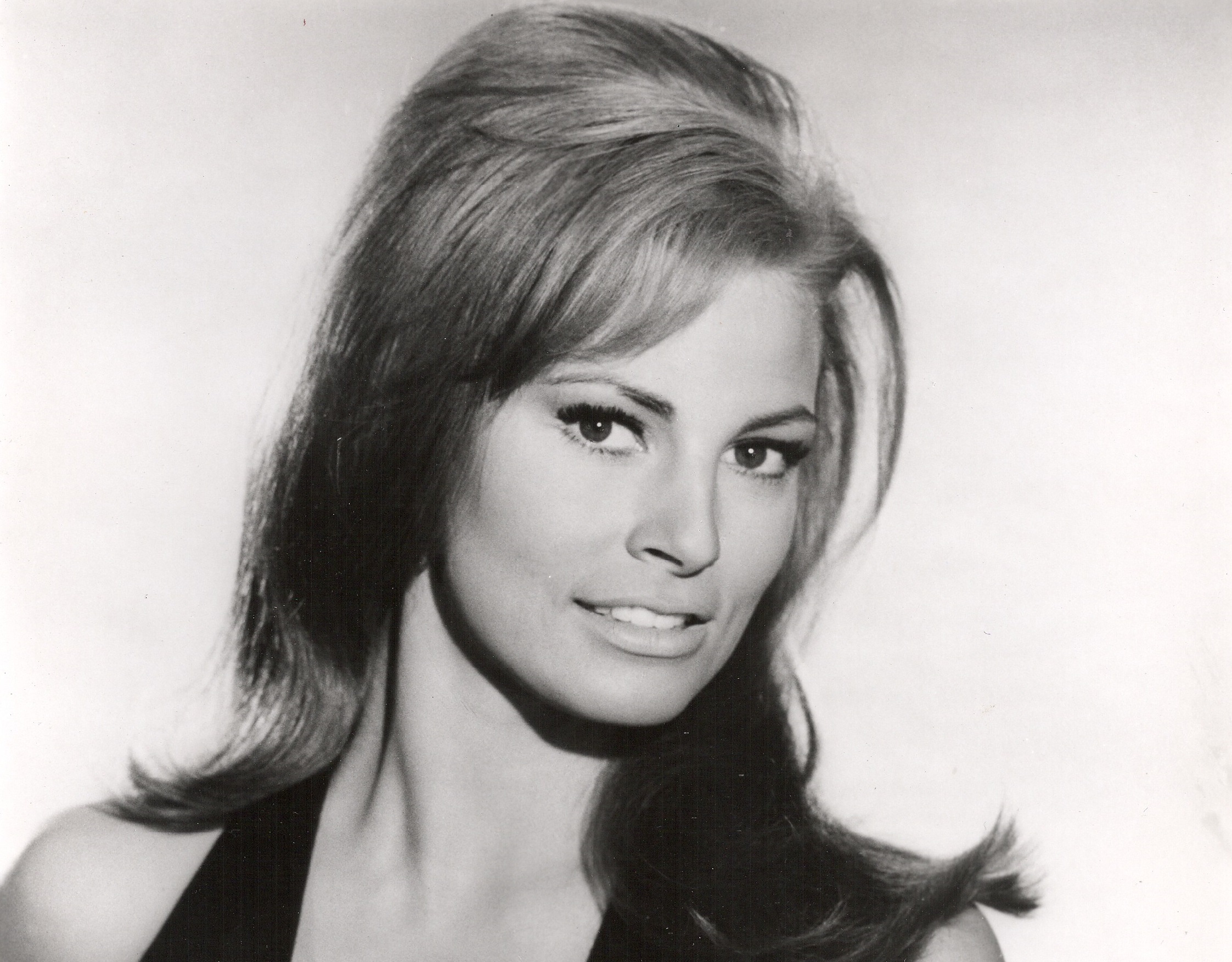 Portrait of Raquel Welch looking at camera.