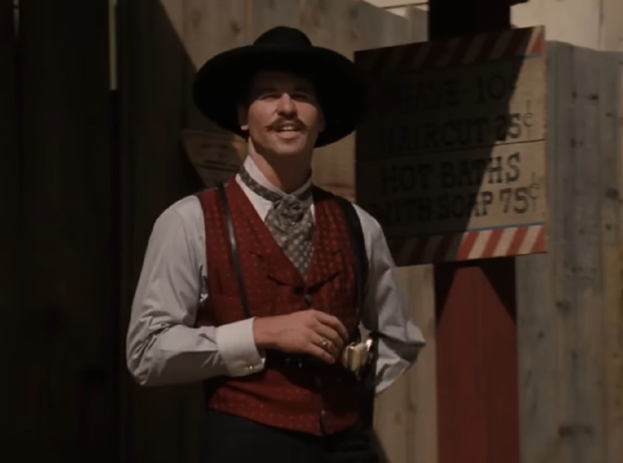 Screenshot of Val Kilmer standing outside - from Tombstone (1993)