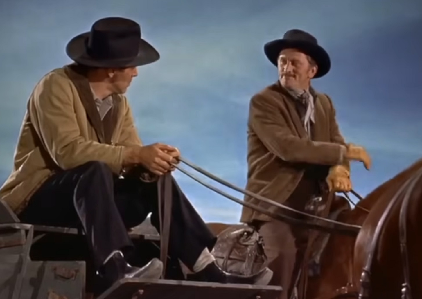 Screenshot of Kirk Douglas riding a horse - from Gunfight At The O.k. Corral (1957)