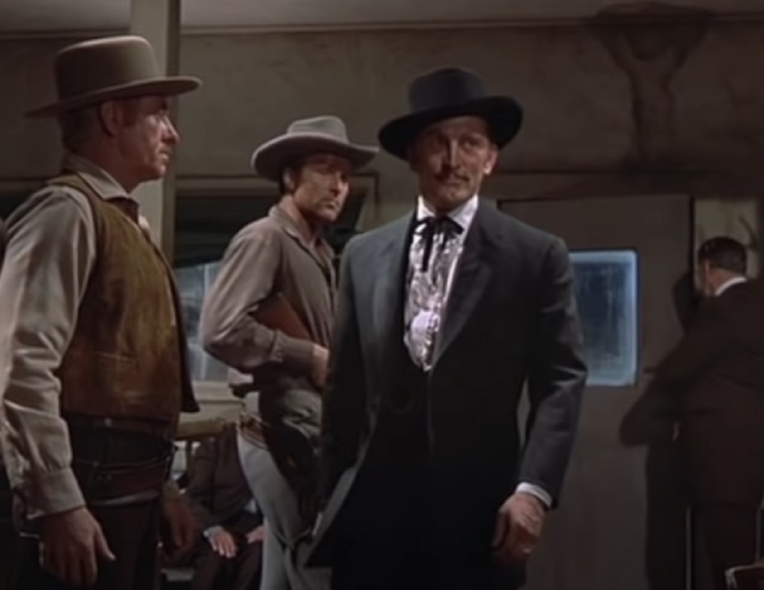 Screenshot of Kirk Douglas walking at saloon - from Gunfight at the O.K. Corral (1957)