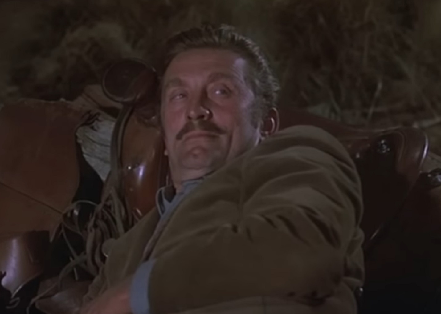 Screenshot of Kirk Douglas laying outside - from Gunfight at the O.K. Corral (1957)