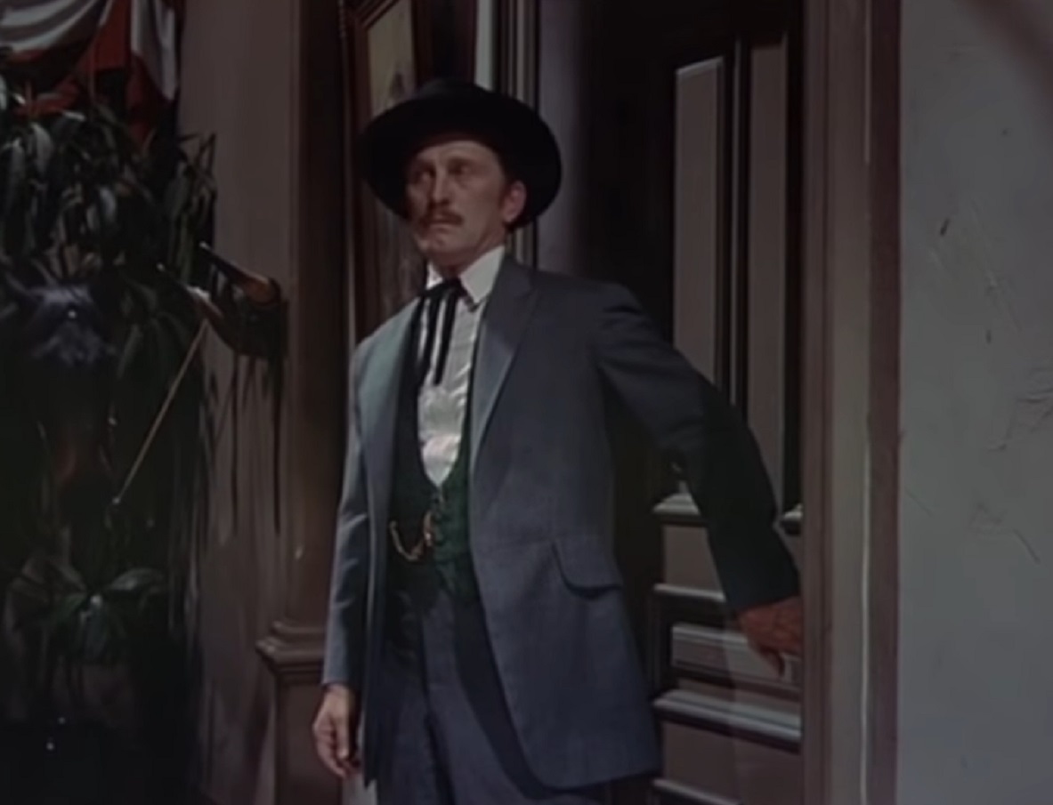 Screenshot of Kirk Douglas standing in saloon - from Gunfight at the O.K. Corral (1957)