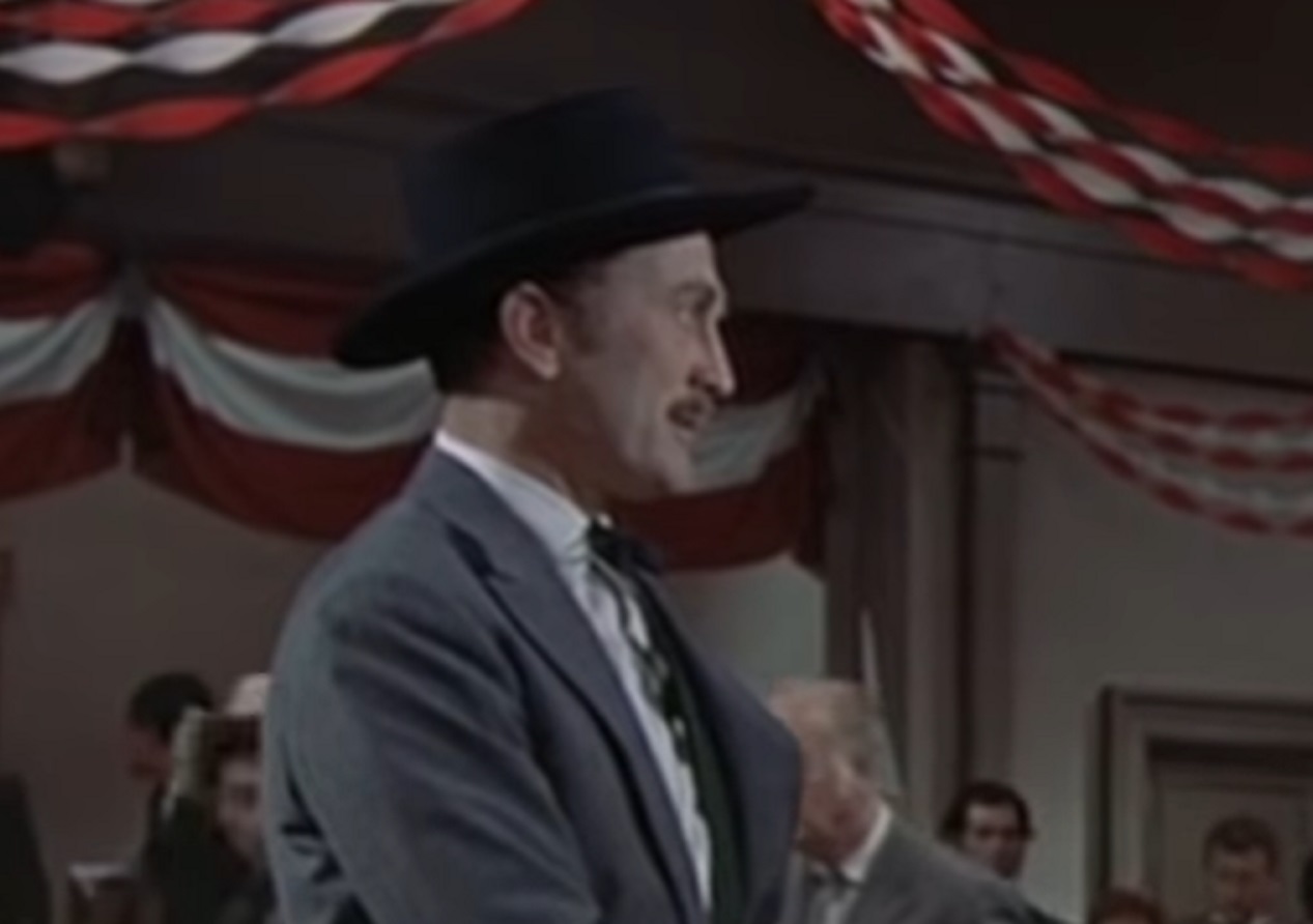 Screenshot of Kirk Douglas standing in saloon - from Gunfight at the O.K. Corral (1957)