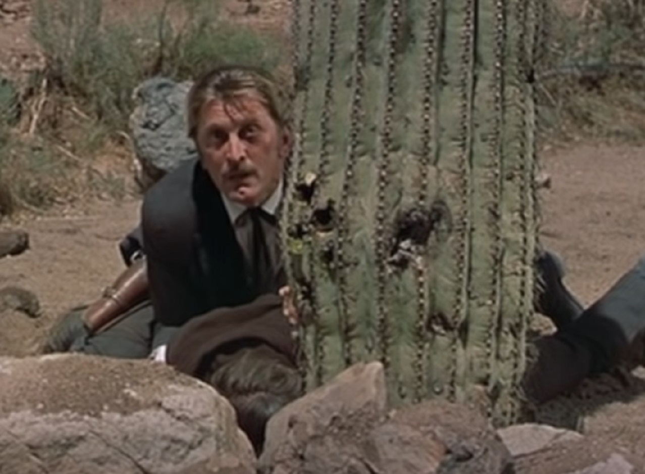 Screenshot of Kirk Douglas hiding outside - from Gunfight at the O.K. Corral (1957)