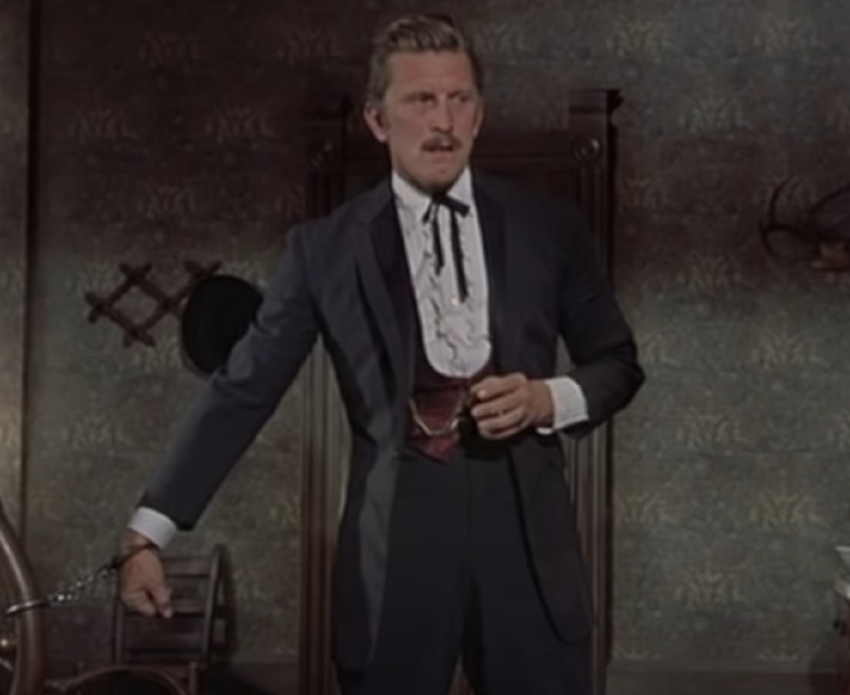 Screenshot of Kirk Douglas in handcuffs - from Gunfight at the O.K. Corral (1957)
