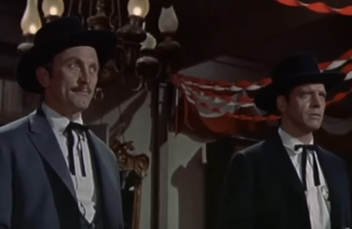 Screenshot of Kirk Douglas and Burt Lancaster standing in saloon - from Gunfight at the O.K. Corral (1957)