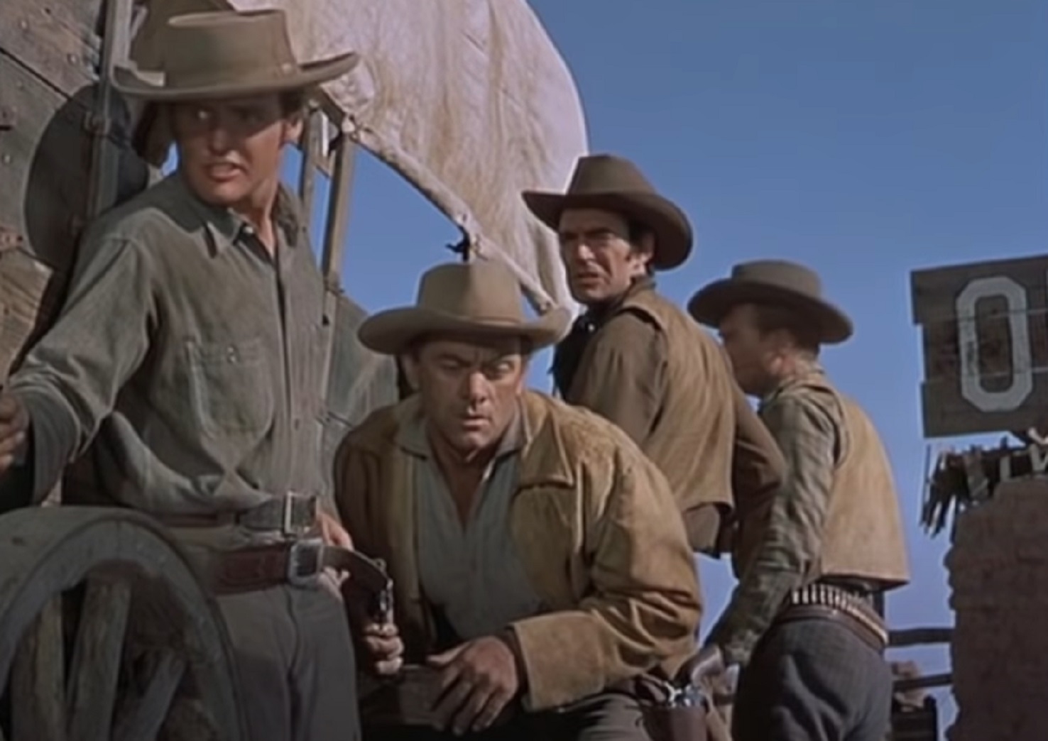 Screenshot of cowboys hiding outside - from Gunfight at the O.K. Corral (1957)