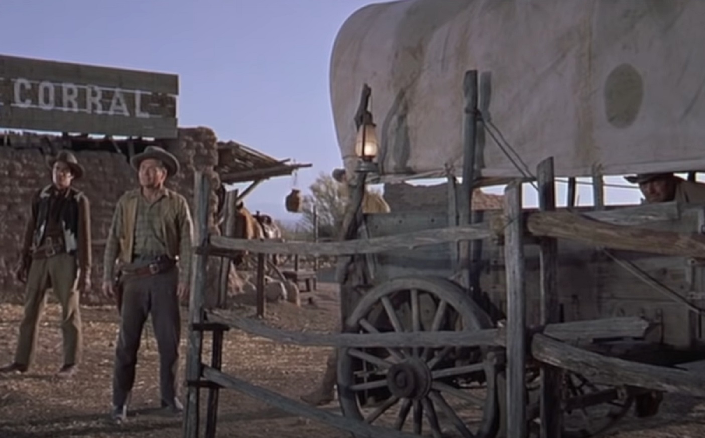 Screenshot of cowboys hiding outside - from Gunfight at the O.K. Corral (1957)