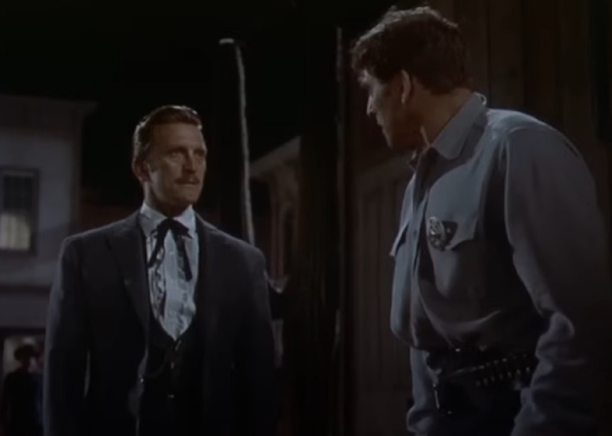 Screenshot of Kirk Douglas and Burt Lancaster standing outside - from Gunfight at the O.K. Corral (1957)
