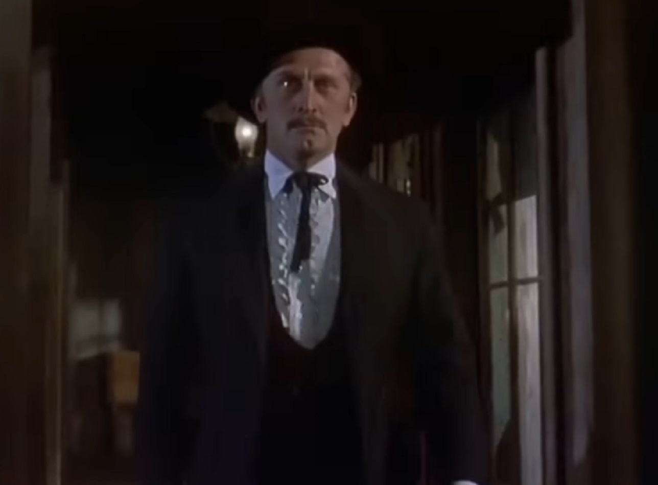 Screenshot of Kirk Douglas walking at saloon - from Gunfight at the O.K. Corral (1957)