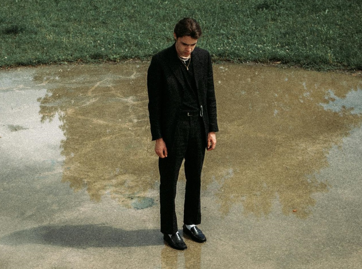 Alone man standing outside.