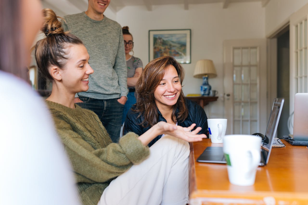Happy people Looking at Laptop and smiling.