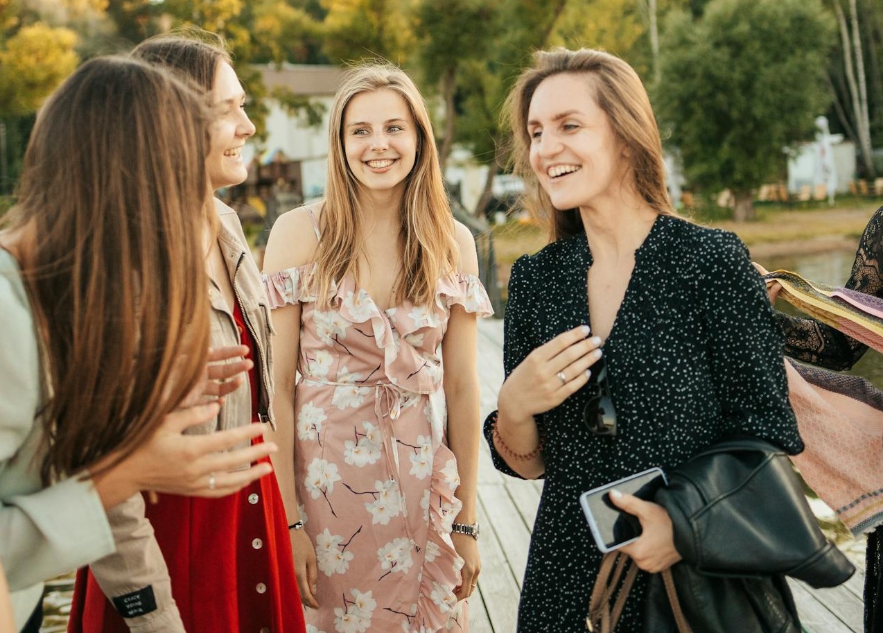 Beautiful Women Laughing while Having Conversation