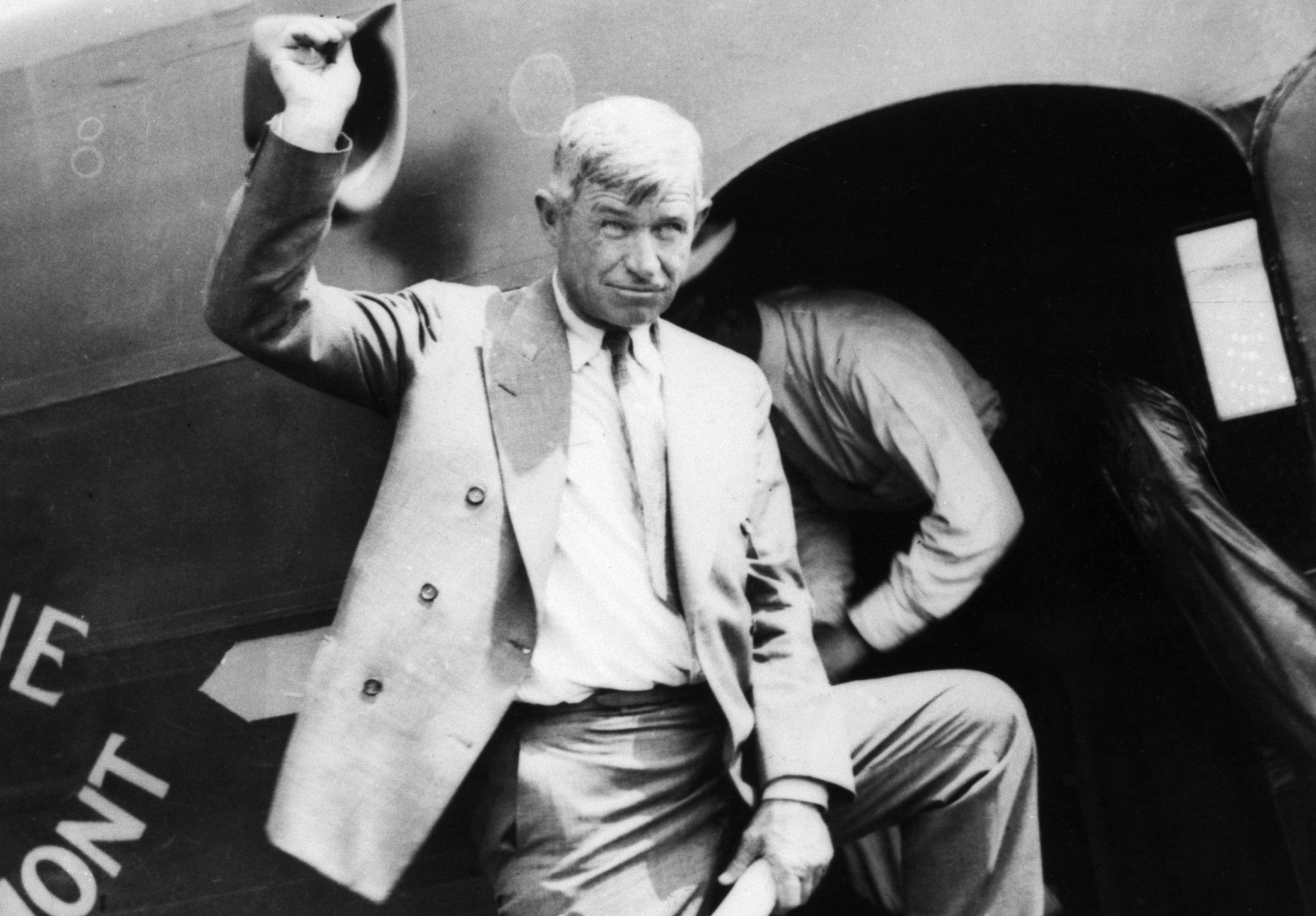 Will Rogers Standing At Plane Entrance