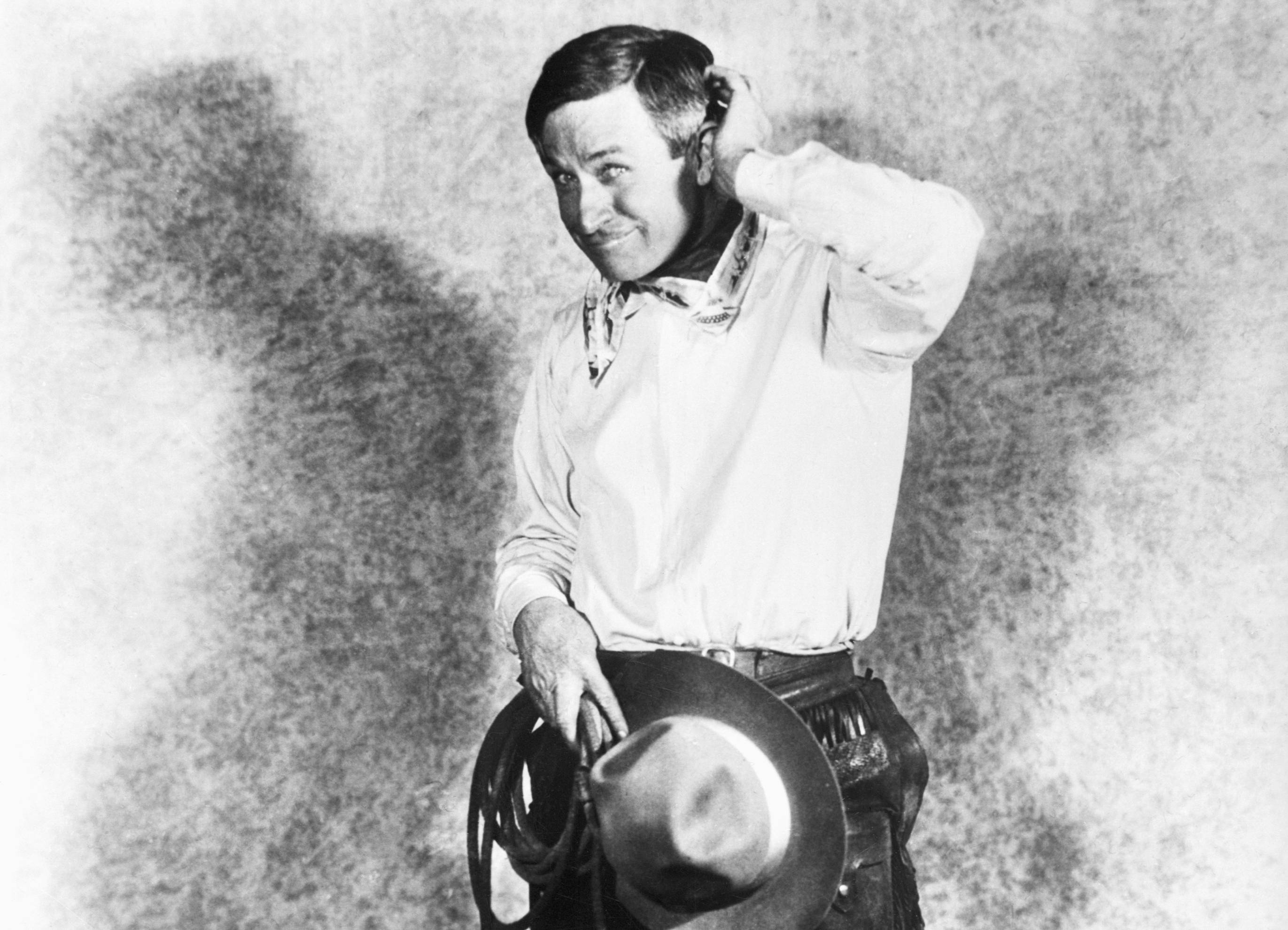 Will Rogers, American humorist (1879-1935), in a typical cowboy pose