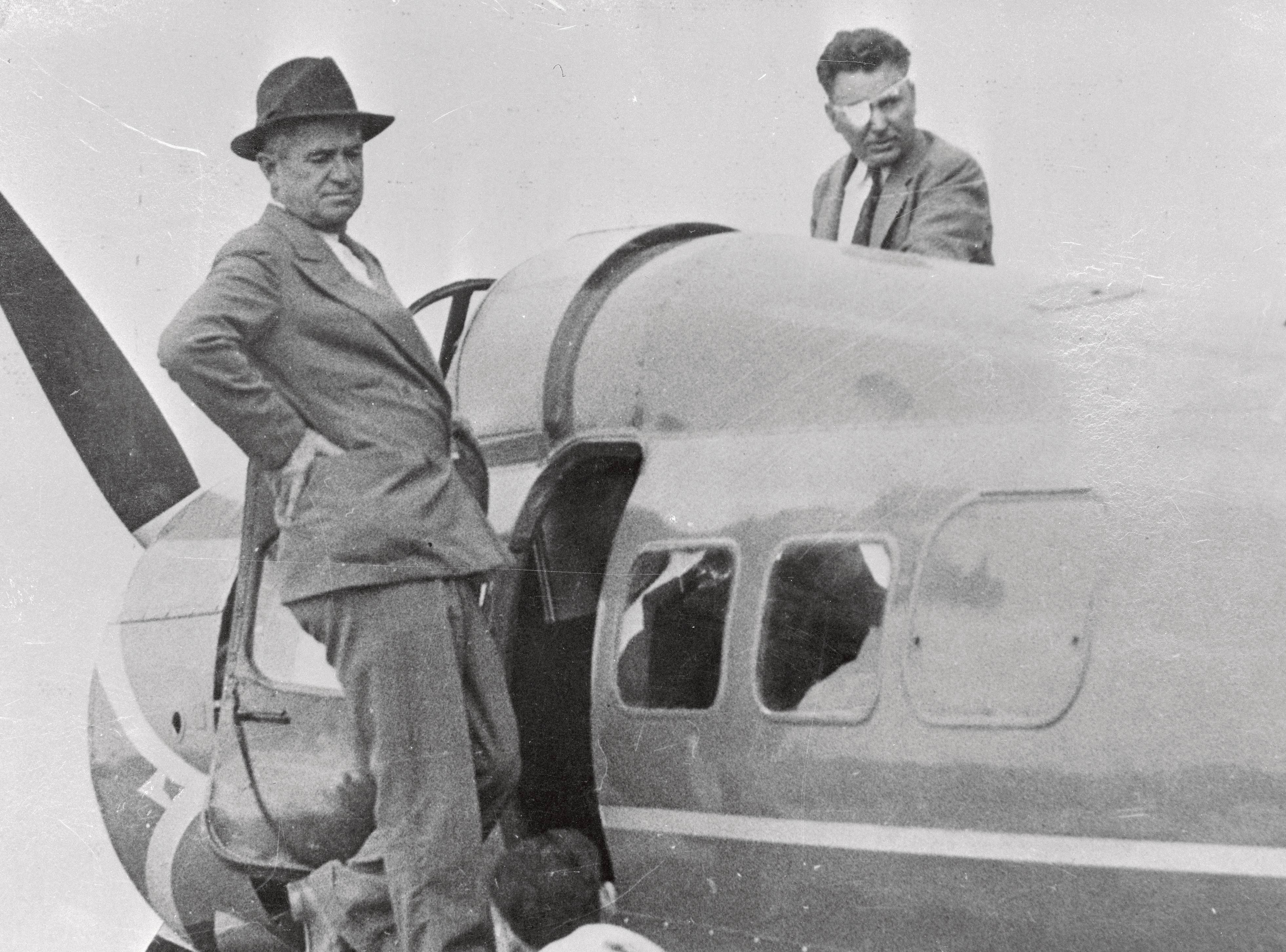 Portrait of Will Rogers and Wiley Post on plane