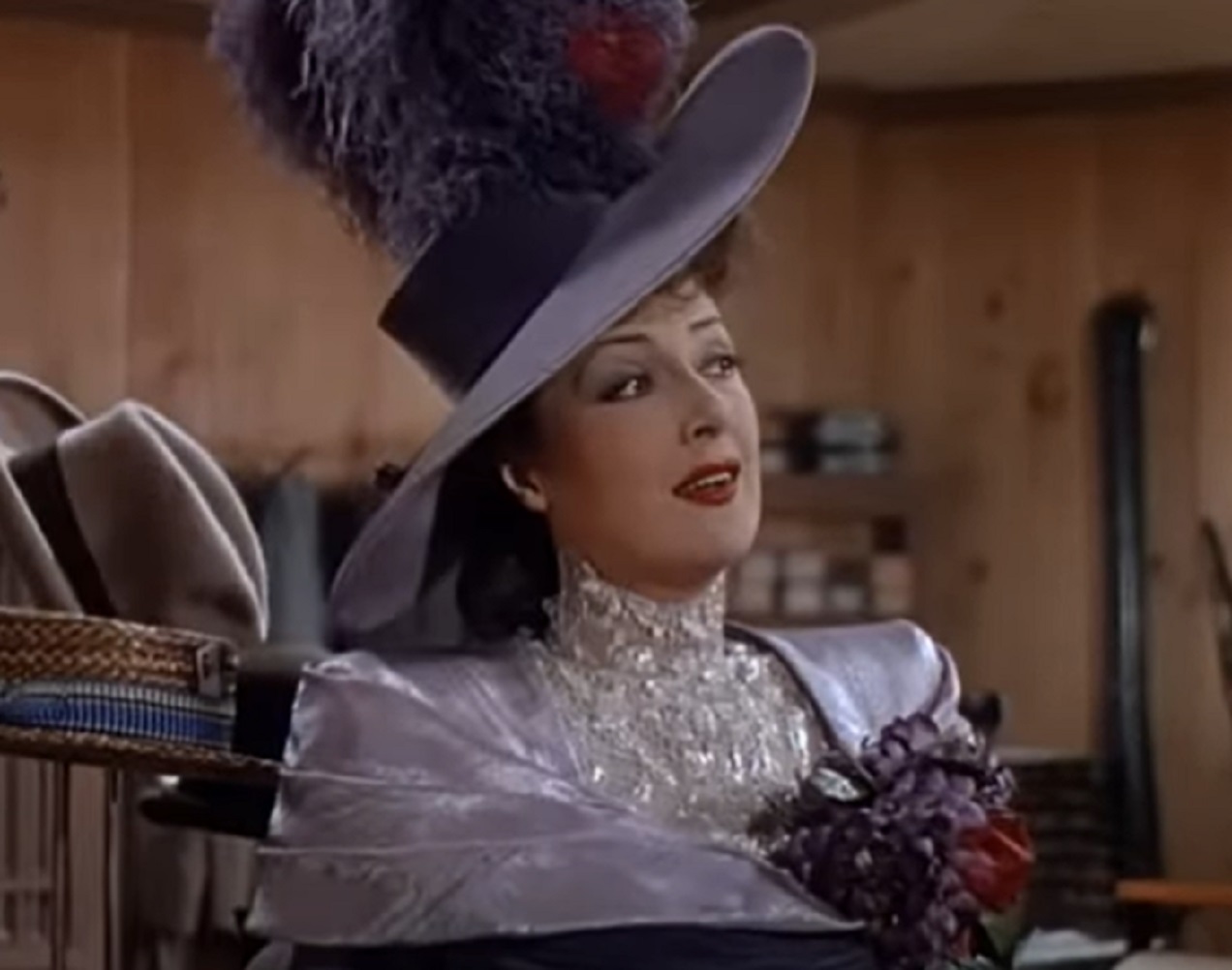 Screenshot of Gypsy Rose Lee looking at side and smiling -  from Belle of the Yukon (1944)