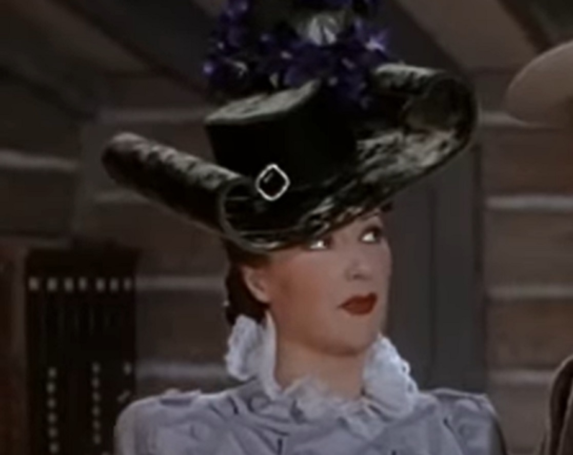 Screenshot of Gypsy Rose Lee with a hat looking at side from - Belle of the Yukon (1944)