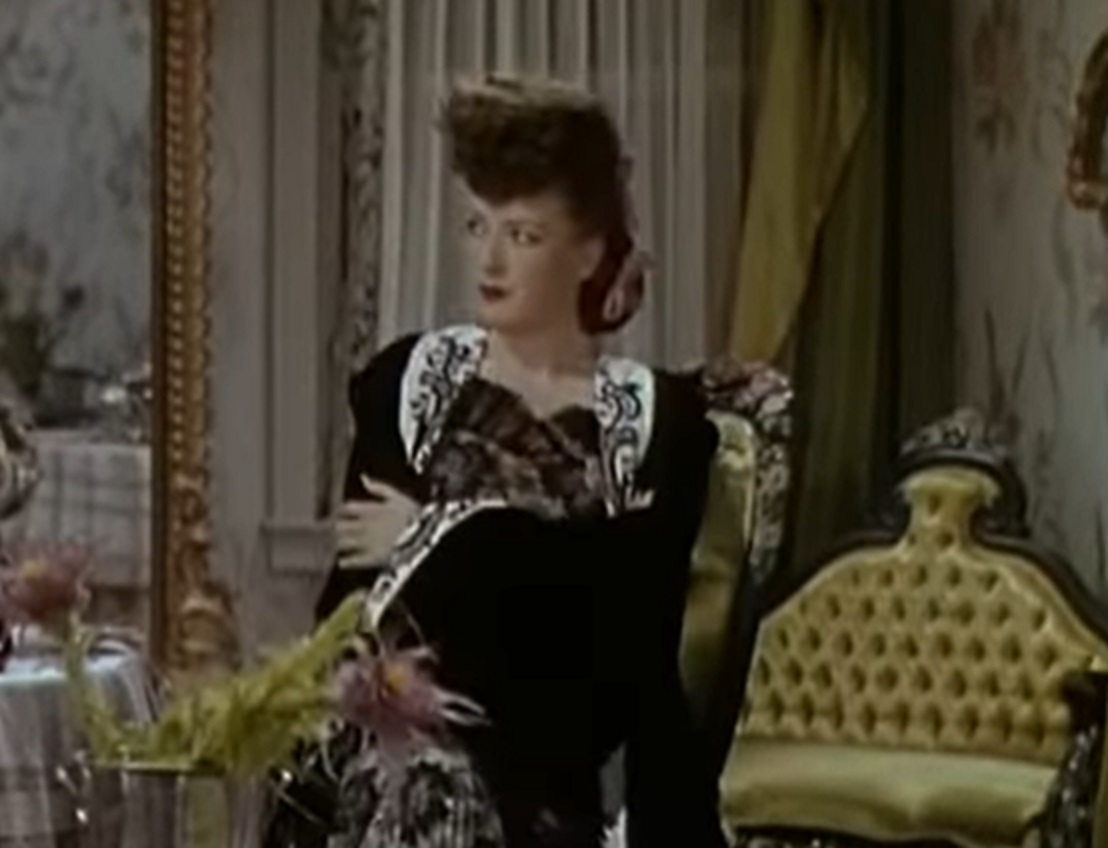 Screenshot of Gypsy Rose Lee looking at side from - Belle of the Yukon (1944)