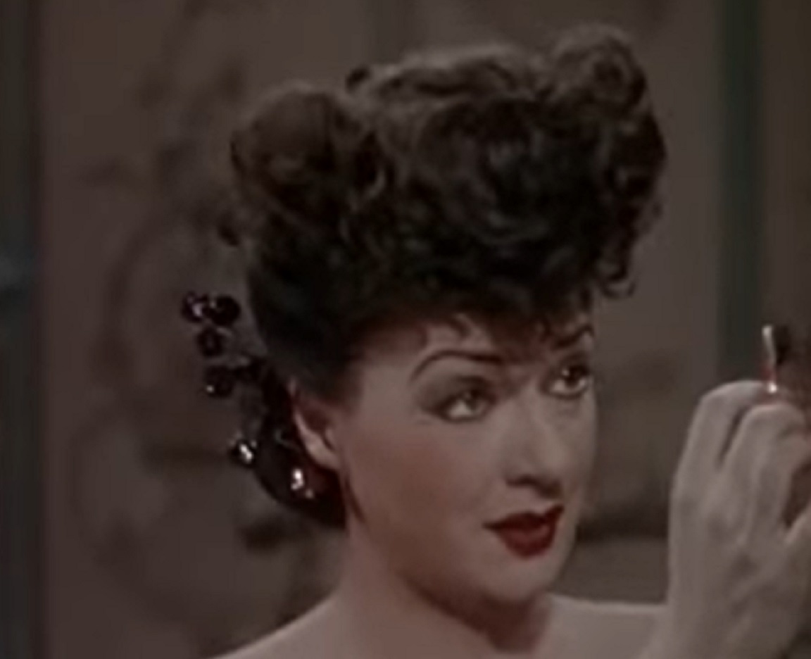 Screenshot of Gypsy Rose Lee looking at side surprised from - Belle of the Yukon (1944)