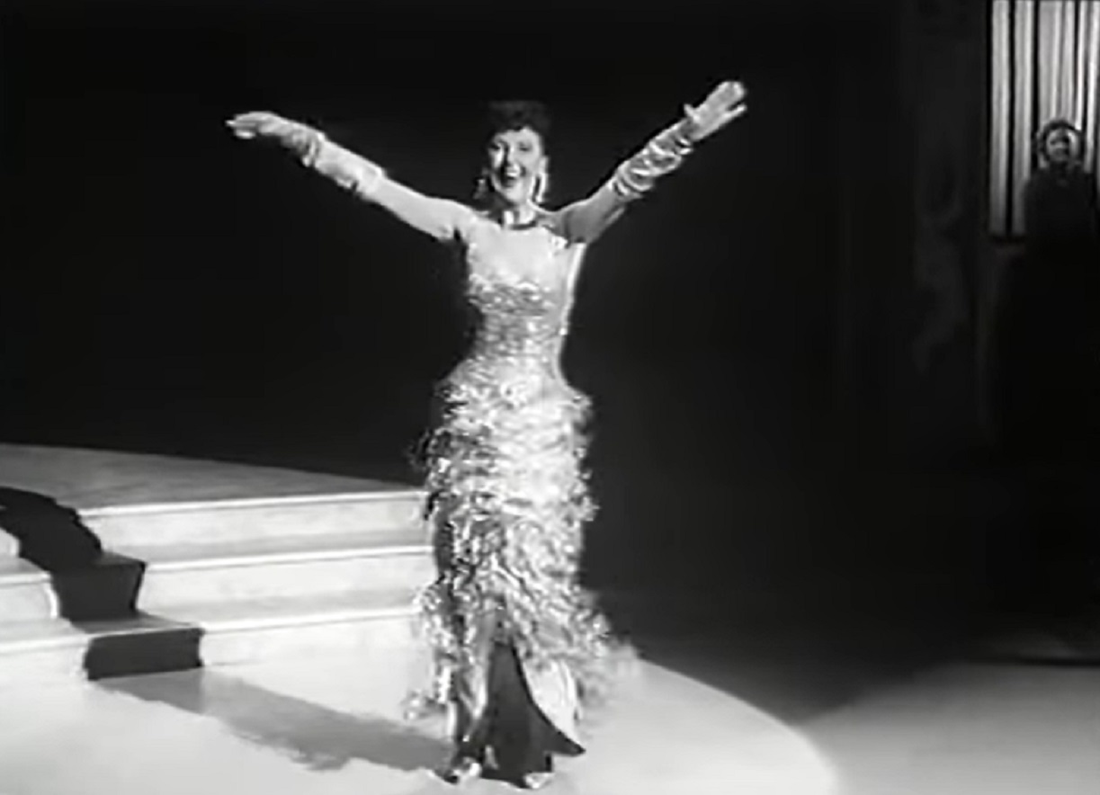 Screenshot of Gypsy Rose Lee dancing on stage from - Screaming Mimi (1958)