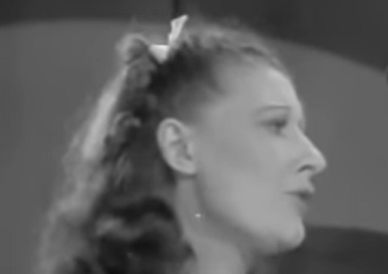 Screenshot of Gypsy Rose Lee looking at side - from My Lucky Star (1938)