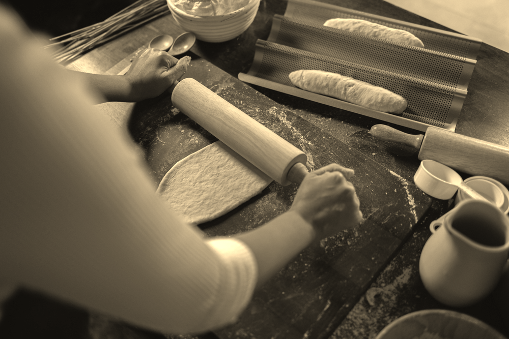 Close up Chef use Rolling pin on dough